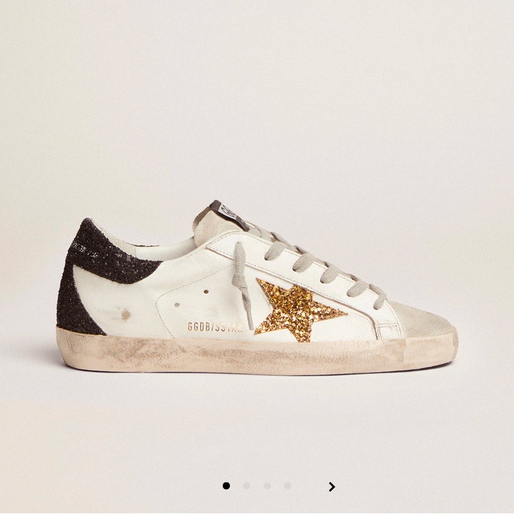 Golden Goose Super-Star LTD with gold star and black glitter heel tab